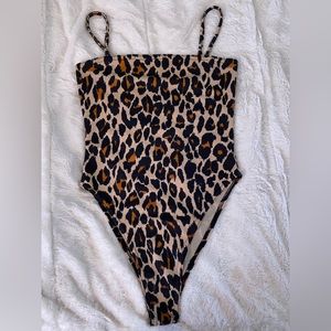 Every girl must have at least 1 cheetah item & this basic bodysuit is perfect!